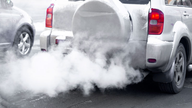 white smoke from exhaust in the morning